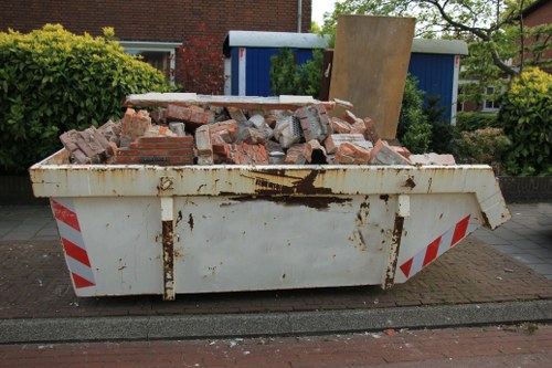 Professionals conducting loft clearance in Greenwich home